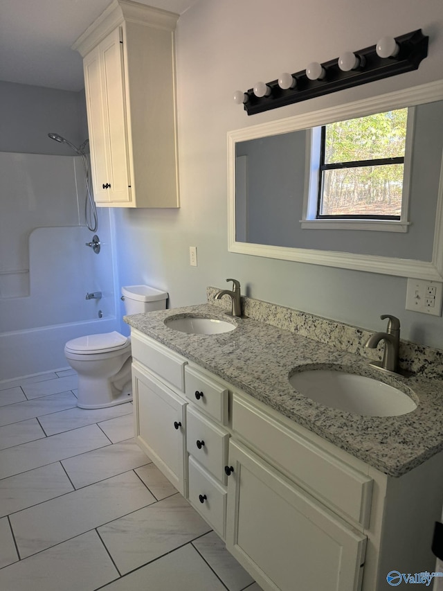 full bathroom with vanity,  shower combination, and toilet