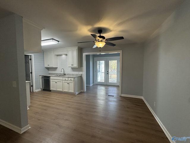 kitchen with french doors, sink, dishwasher, hardwood / wood-style floors, and white cabinets