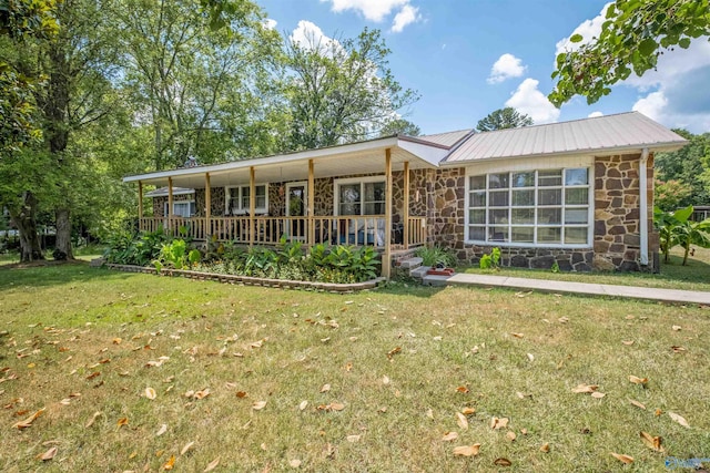 ranch-style house with covered porch and a front yard