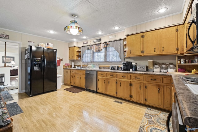 kitchen featuring hanging light fixtures, ornamental molding, black appliances, a textured ceiling, and light wood-type flooring