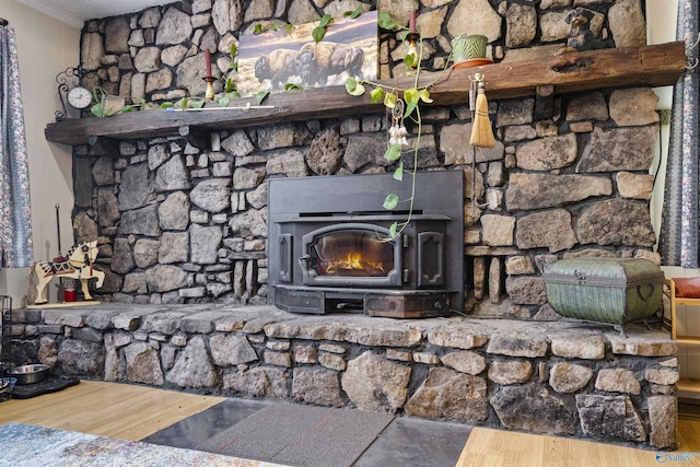 interior details with crown molding and a wood stove