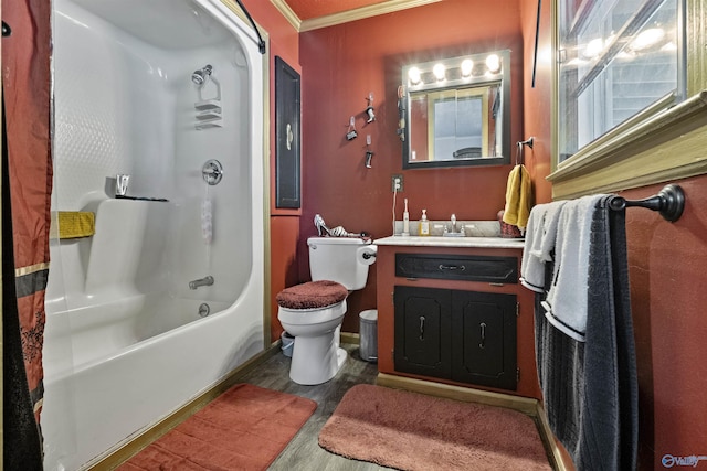 full bathroom featuring hardwood / wood-style floors, shower / bath combination with curtain, vanity, toilet, and crown molding