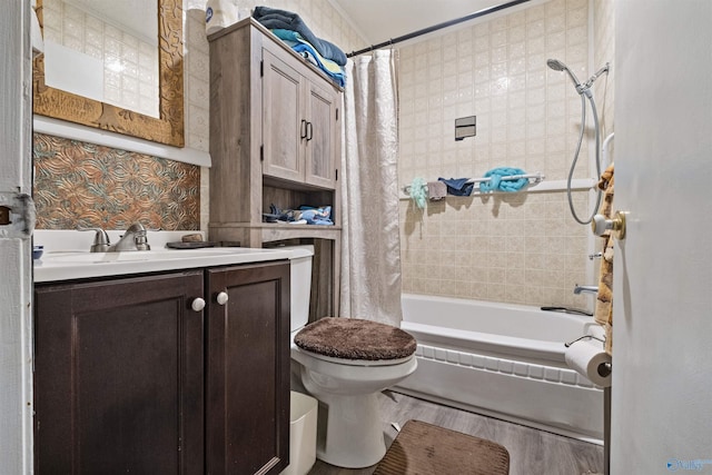 full bathroom with vanity, toilet, hardwood / wood-style floors, and shower / bath combo