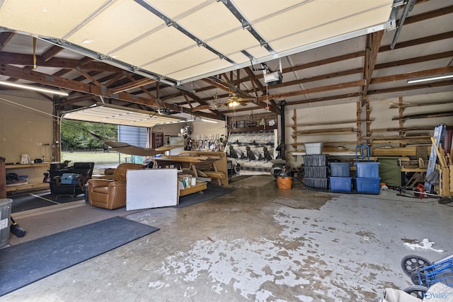 garage featuring a garage door opener and a workshop area