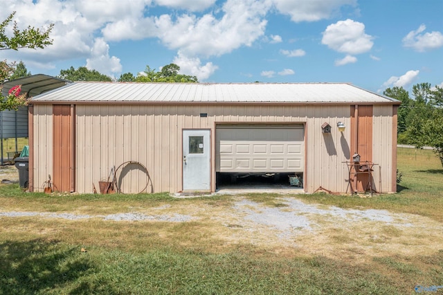 garage with a yard