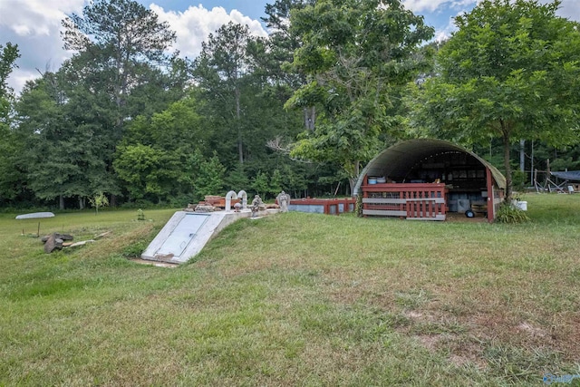 entry to storm shelter featuring a yard