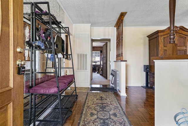 hallway with heating unit, a textured ceiling, and dark parquet floors