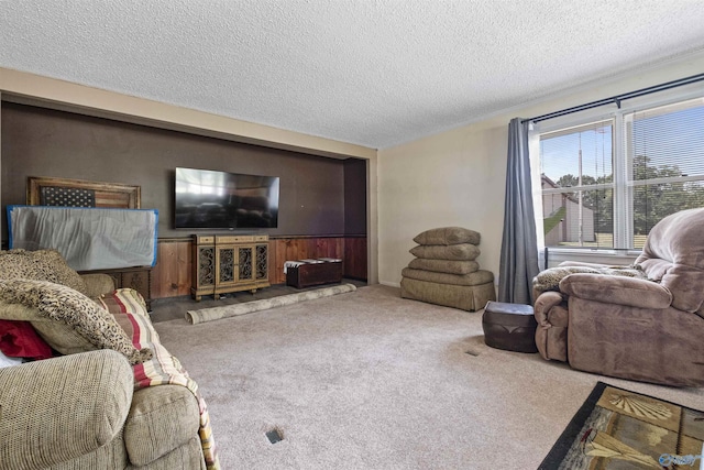 carpeted living room featuring a textured ceiling