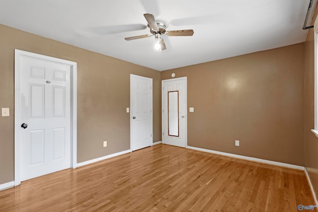 unfurnished bedroom with ceiling fan and light hardwood / wood-style floors