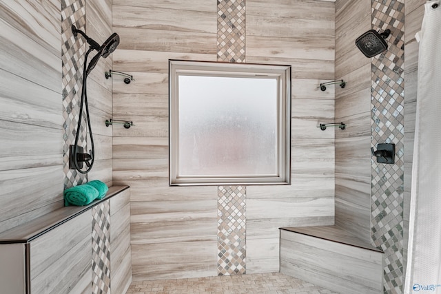 bathroom with a tile shower