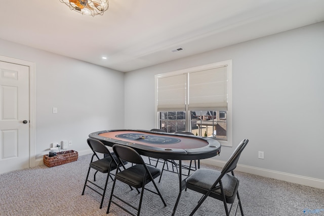 view of carpeted dining space