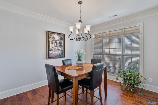 dining area with an inviting chandelier, wood-type flooring, and ornamental molding