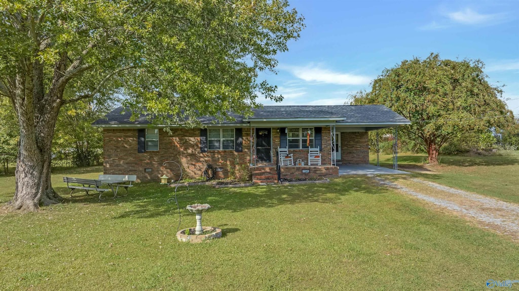 ranch-style home featuring a front yard