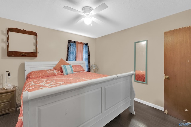 bedroom featuring ceiling fan and dark hardwood / wood-style flooring