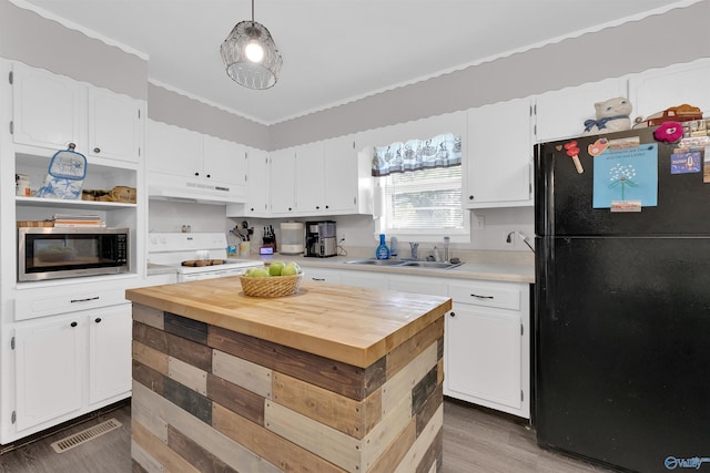 kitchen with hardwood / wood-style flooring, black fridge, electric range, decorative light fixtures, and white cabinetry