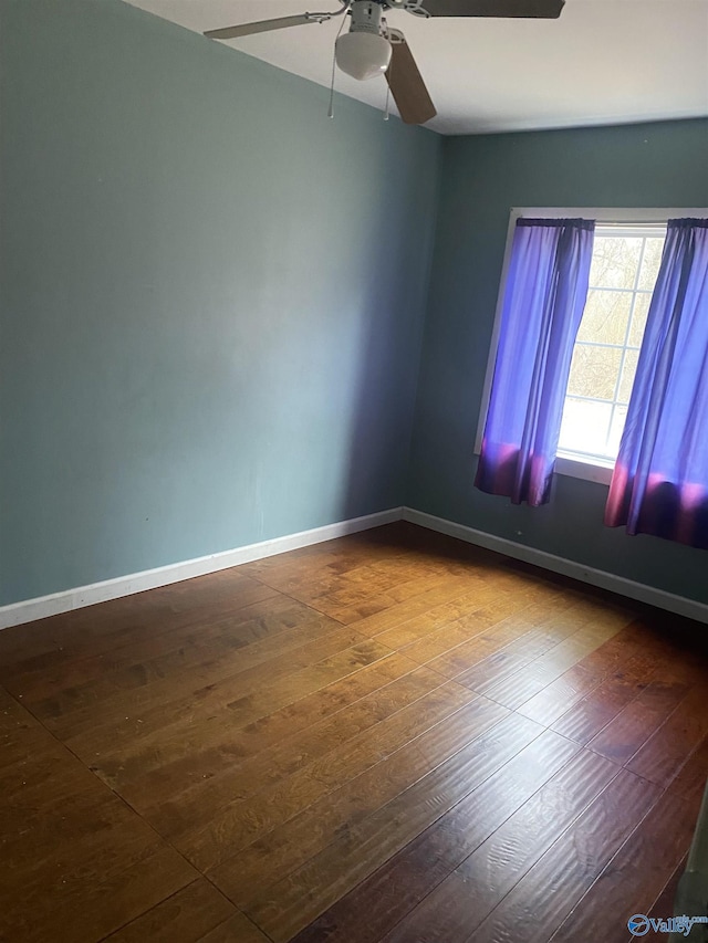 unfurnished room featuring ceiling fan and hardwood / wood-style floors