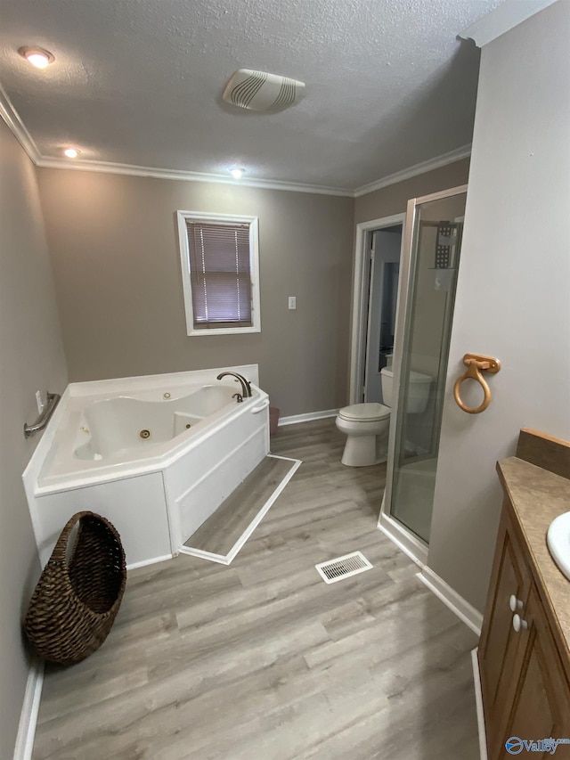 full bathroom with vanity, hardwood / wood-style flooring, crown molding, and a textured ceiling