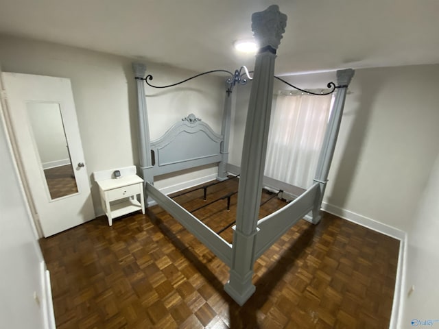 bedroom featuring dark parquet floors