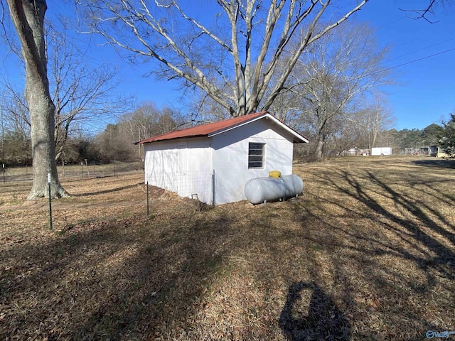 view of property exterior featuring a storage unit