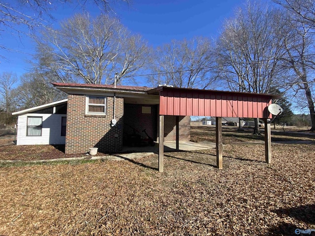 view of outbuilding featuring a carport