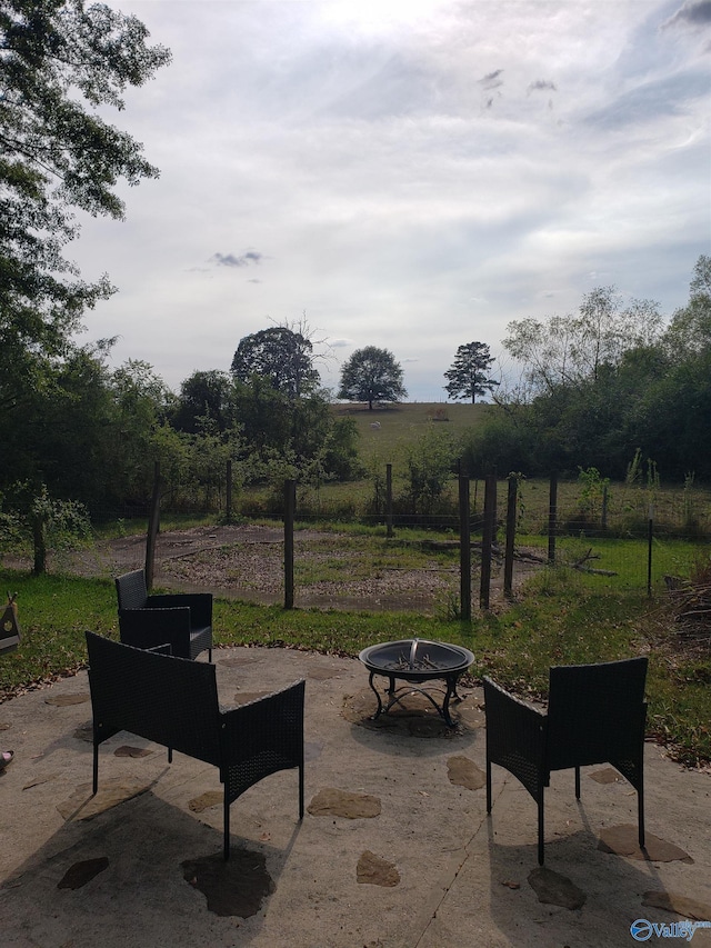 view of community with a patio area and an outdoor fire pit