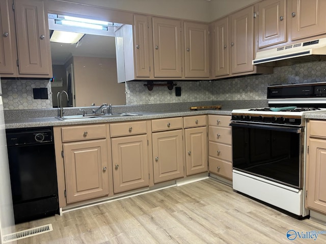 kitchen featuring dishwasher, gas range, sink, tasteful backsplash, and light hardwood / wood-style floors