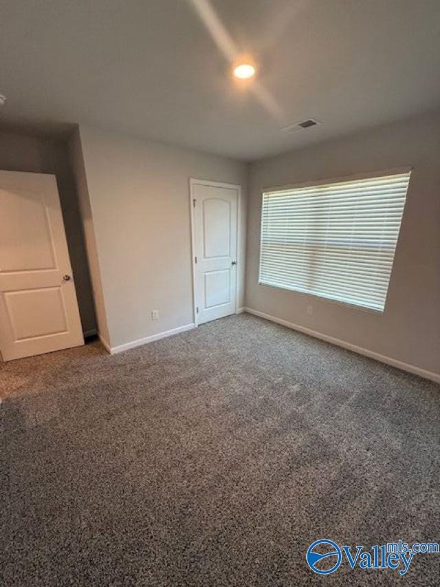 196 Murphy Ln, Madison, AL 35756 - spare room with baseboards and carpet flooring