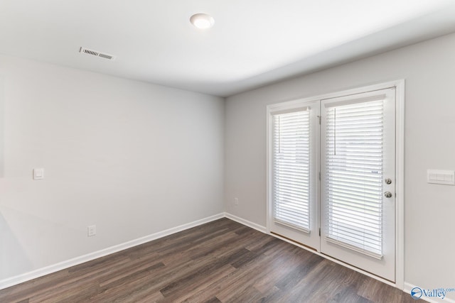 196 Murphy Ln, Madison, AL 35756 - empty room with dark wood finished floors and baseboards