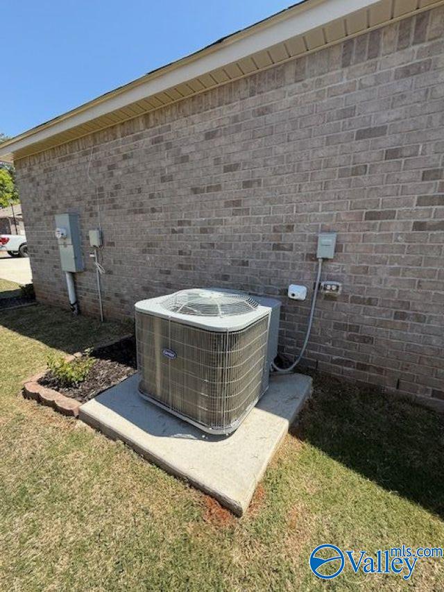 196 Murphy Ln, Madison, AL 35756 - exterior view of cooling unit, electric meter, and brick siding