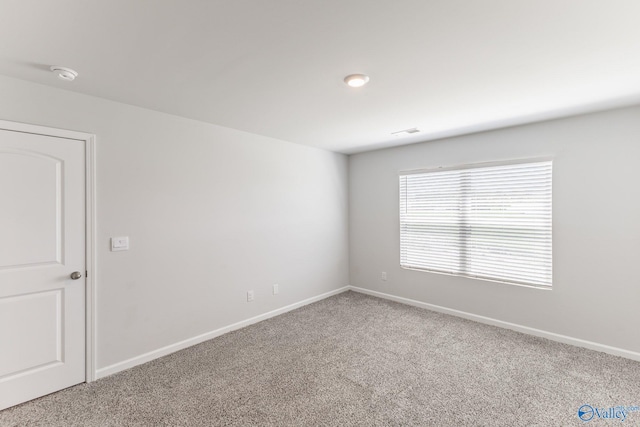 196 Murphy Ln, Madison, AL 35756 - empty room featuring carpet flooring, baseboards, and a smoke detector