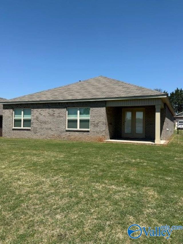 196 Murphy Ln, Madison, AL 35756 - rear view of property with brick siding, a yard, french doors, and roof with shingles