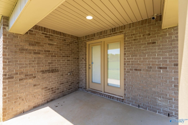196 Murphy Ln, Madison, AL 35756 - property entrance featuring a patio area and brick siding