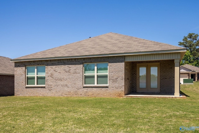 196 Murphy Ln, Madison, AL 35756 - back of house with brick siding, a yard, roof with shingles, and french doors