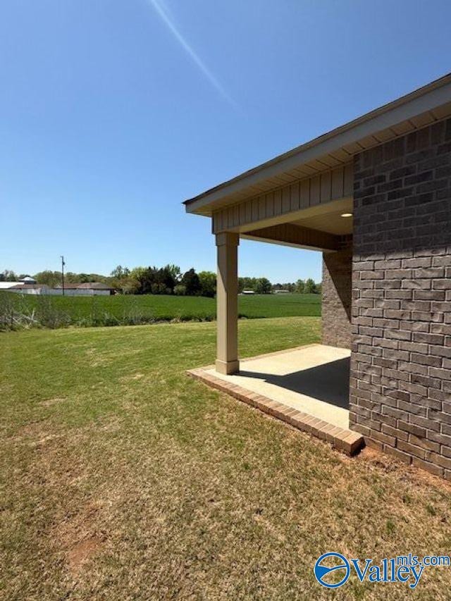 196 Murphy Ln, Madison, AL 35756 - view of green lawn with a patio area
