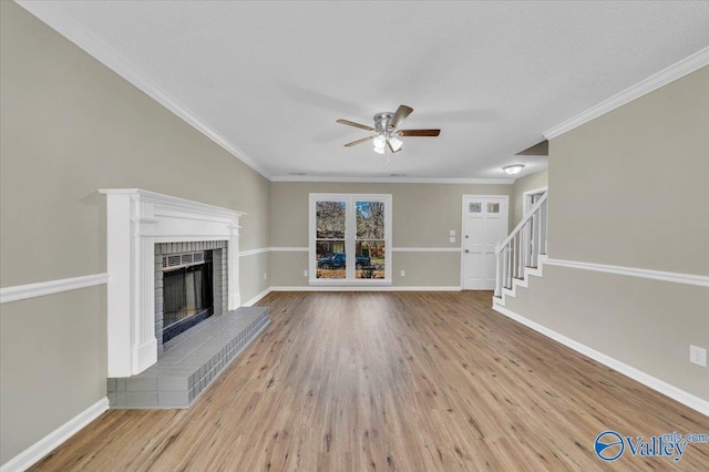 unfurnished living room with wood finished floors, baseboards, and ceiling fan