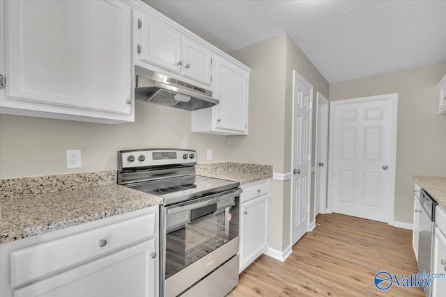 kitchen featuring a textured ceiling, under cabinet range hood, white cabinetry, light wood-style floors, and electric range