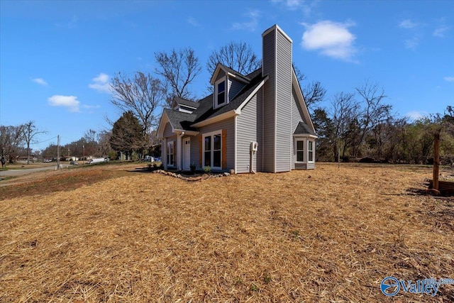 view of home's exterior featuring a yard