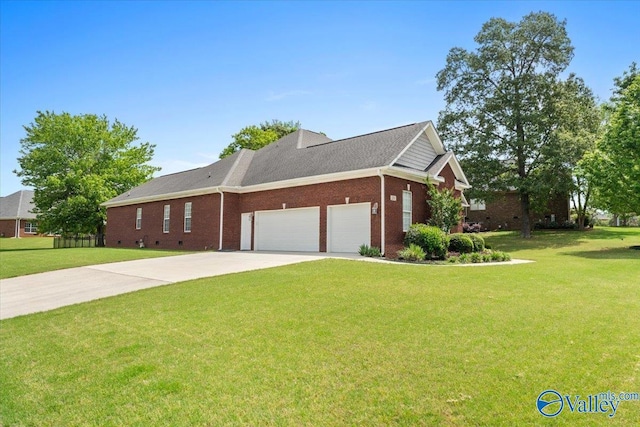 exterior space featuring brick siding, a garage, a front lawn, and driveway