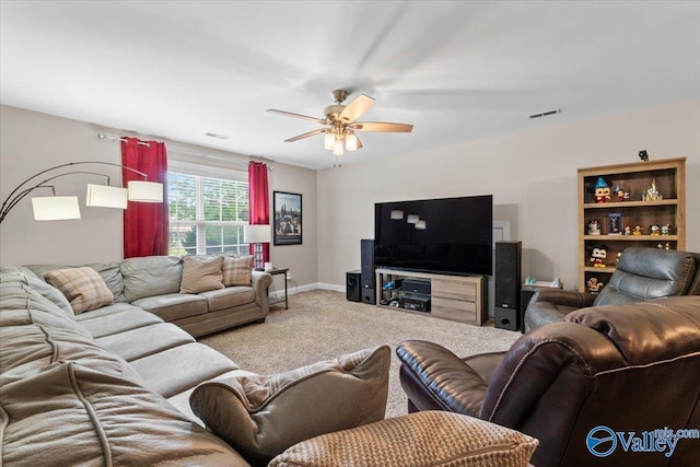 living area with visible vents, a ceiling fan, and carpet