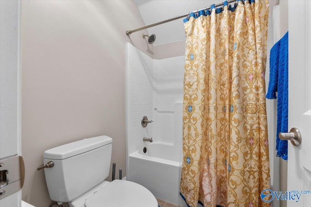 bathroom with shower / tub combo with curtain and toilet