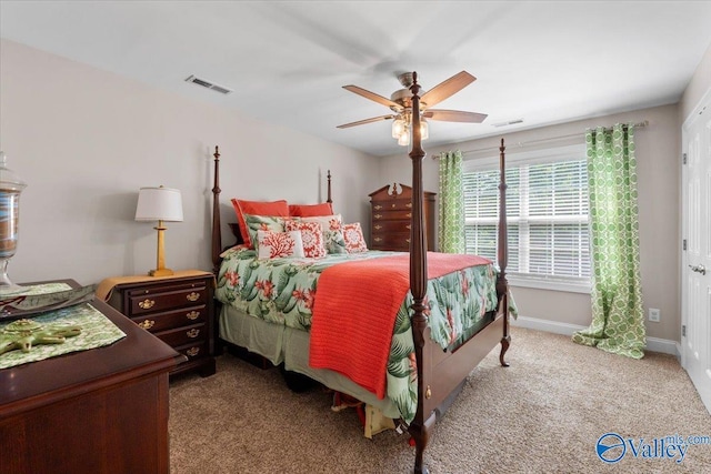 bedroom with carpet floors, a ceiling fan, baseboards, and visible vents