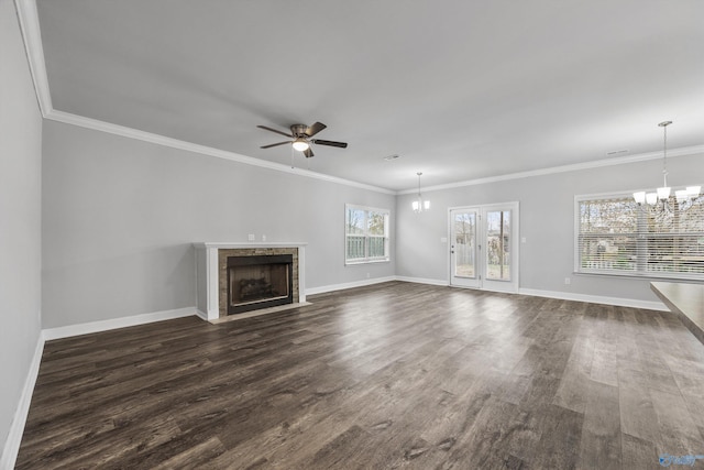 unfurnished living room with ornamental molding, dark hardwood / wood-style flooring, and ceiling fan with notable chandelier