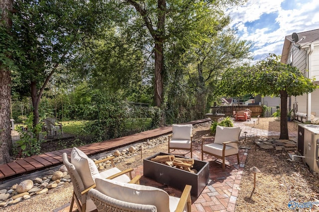 view of patio / terrace with an outdoor fire pit