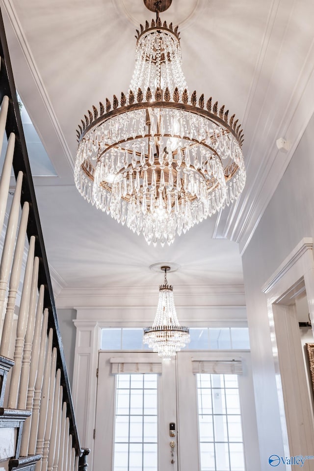 details with crown molding and an inviting chandelier