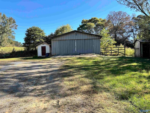 view of outbuilding featuring a yard