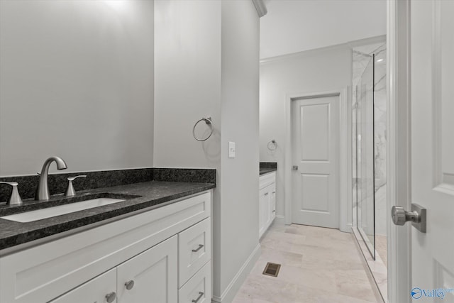 bathroom featuring vanity and an enclosed shower