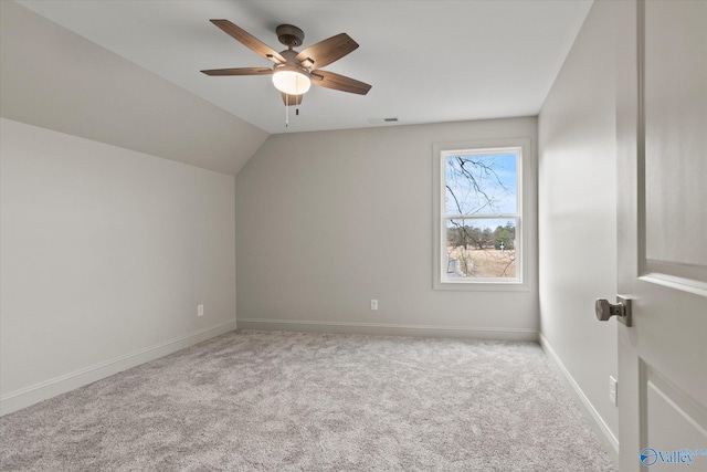 bonus room with lofted ceiling, light colored carpet, and ceiling fan