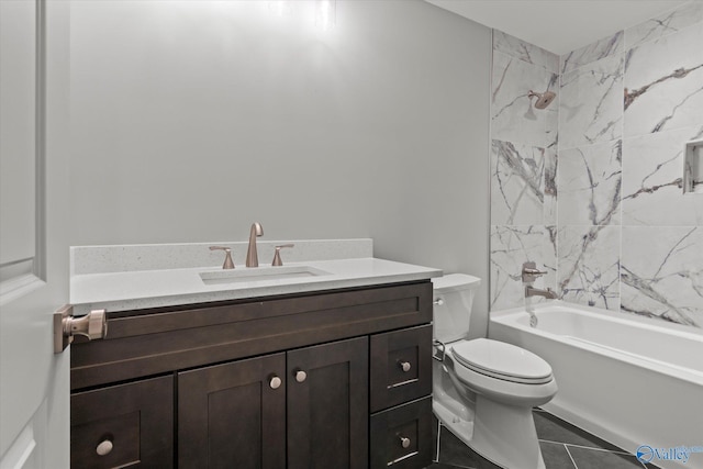 full bathroom with vanity, tile patterned floors, toilet, and tiled shower / bath