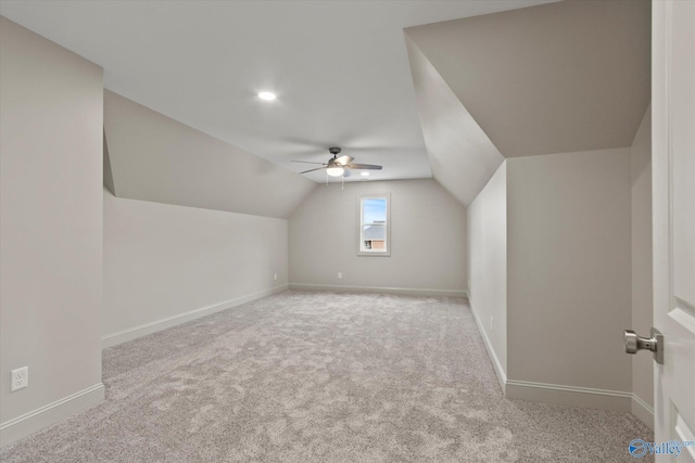 bonus room with lofted ceiling, light colored carpet, and ceiling fan