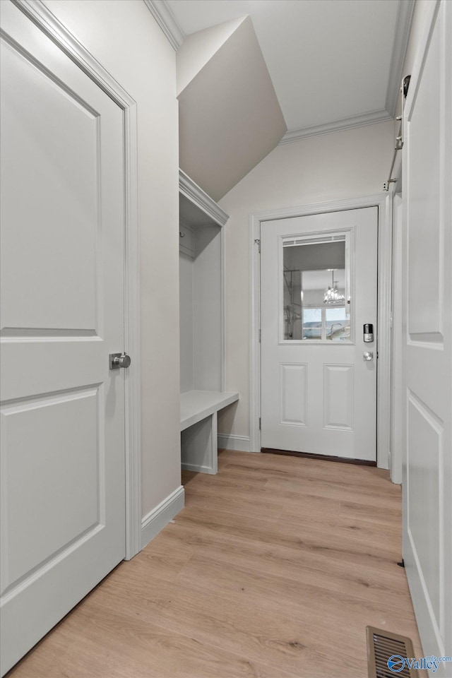 mudroom with vaulted ceiling and light hardwood / wood-style flooring